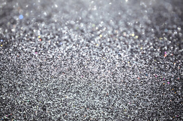 Silver shimmering surface shining glitter background Party concept New year Birthday Glowing texture  wedding Christmas template Glowing Copy space greeting text Holiday surface Defocused bokeh