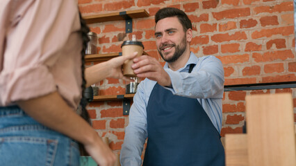 Woman customer pay use contactless payment technology NFC on phone in cafe bar restaurant smiling man waiter barista serving client at counter in cafeteria girl paying through bank mobile app terminal