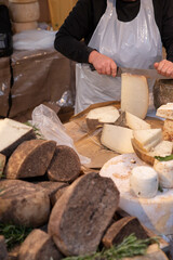 Traditional italian mature cheese Pecorino at the market stall. Close up.