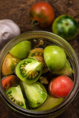 Making a delicious snack from unripe tomatoes.