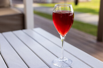 Sip of Elegance: Rich Red Drink for a Taste of Sophistication.