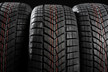 Close up of winter tires showing tread pattern for enhanced grip on snowy roads