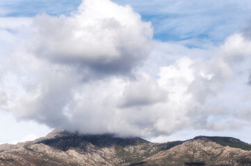 Cumulus Congestus Clouds against blue sky over the montain