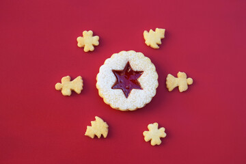 Linzer cookies on red background. Christmas time