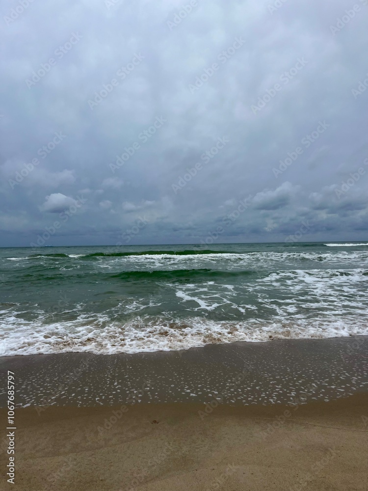 Canvas Prints cloudy grey seascape, waved sea horizon, windy at the sea, empty beach