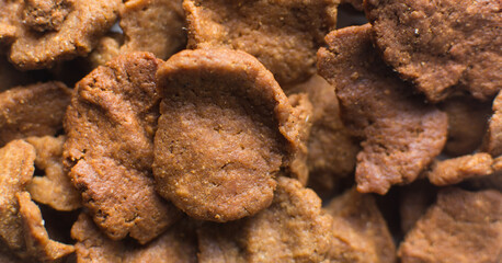 Overhead view of kuli-kuli, close-up view of nigerian groundnut cakes on a plate, fresh homemade nigerian kulikuli