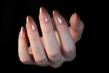 Stylish Babyboomer Gradient: A woman’s hand with nails where each one appears as a true piece of art. The black background adds depth and highlights the soft, gentle transition.