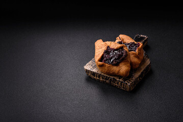 Sweet rye pies with cherries and chocolate