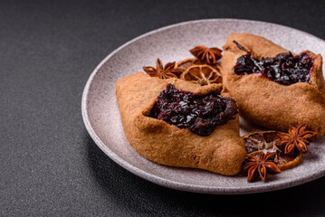 Sweet rye pies with cherries and chocolate