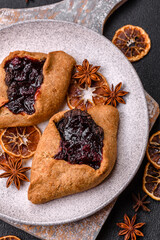 Sweet rye pies with cherries and chocolate