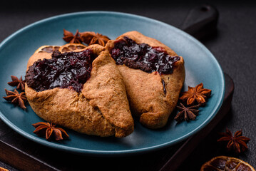 Sweet rye pies with cherries and chocolate