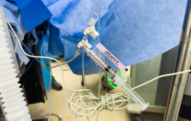 syringes filled with various medications, neatly lined on a sterile hospital surface. Symbolizes medical care, treatment, precision, and the vital role of healthcare resources