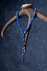 Ottoman Amber Rosary Collection products. Rosary hanging on antlers (focus adjusted)