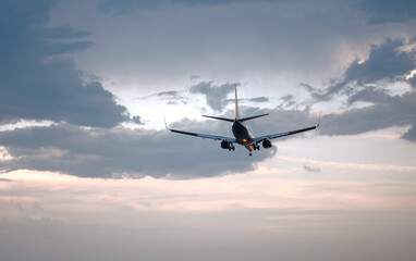 Passenger Airplane Landing Take-Off at Sunrise Dawn