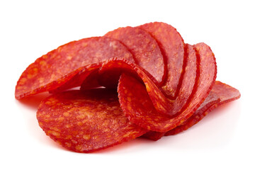 Spanish pork chorizo sausage slices, close-up, isolated on white background.