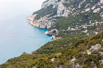 Obraz premium Beautiful view at Sardinian coast in Gulf of Orosei region, Italy. Blue Mediterranean sea view near Cala Sisine beach. Beautiful Sardinian landscape.