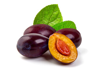 Red plums with green leaves, isolated on white background.