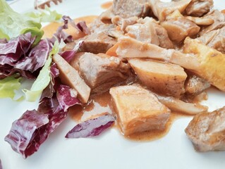 stew dish with potato and mushroom sauce