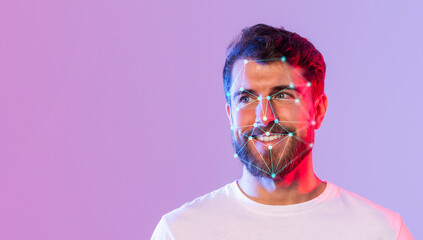 A young man with a beard smiles while facial recognition markers illuminate his face. The colorful background enhances the modern technology theme, creating a vibrant atmosphere.