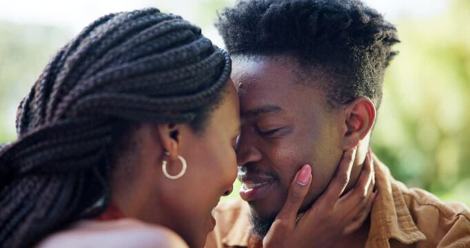 Love, nature and black couple with forehead touch on date for romance, connection and commitment. Care, happy and African people with bonding for relationship outdoor in park together on weekend trip