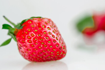 Strawberry as a symbol of the dietary and nutritional food. Close up.