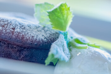 Delicious chocolate cake on plate on light background. Selective focus.