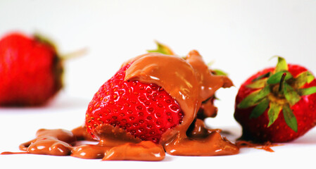 Strawberries in chocolate as a symbol of delicious food. Horizontal image.