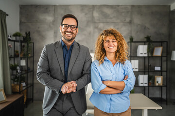 Portrait of businessman and businesswoman at office