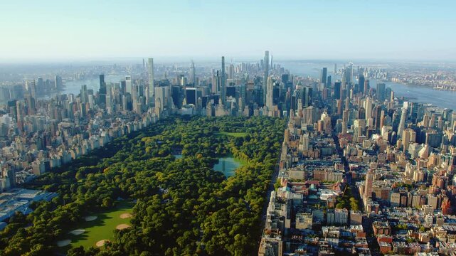 Aerial Helicopter Footage Over Central Park with Nature, Trees. Manhattan Skyscrapers Cityscape. Midtown New York City Beautiful Sunny Day