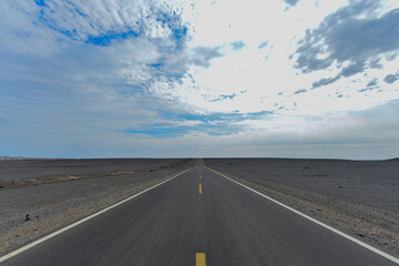 Desert road sand dunes in Xinjiang, China