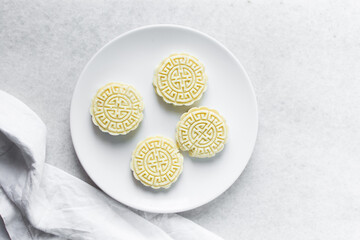 Overhead view of tuwon madara on a white plate, nigerian alawar madara milk candy, top view of milk...