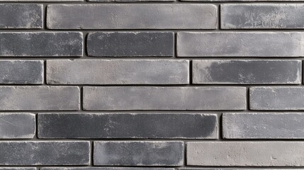 Fototapeta premium A straight-on view of a newly built brick wall, showcasing clean lines and fresh mortar, ideal for construction-themed visuals.