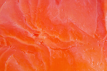 Red salmon fish fillet macro photo as background. Texture of fish fillet.