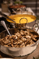 Fresh mushrooms in pot ready to be served during catering event