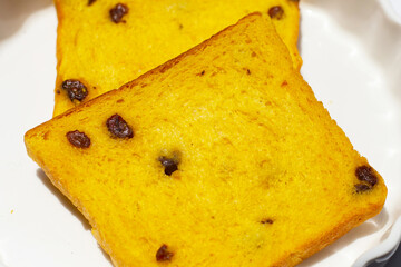 Whole grain bread slices on plate