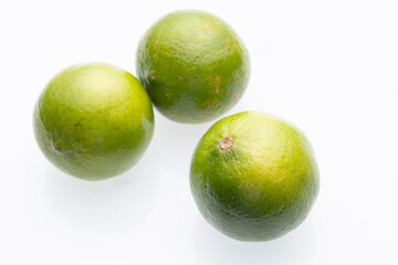 Three Green Limes Isolated On White Background