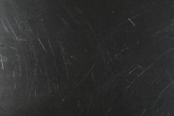 Old metal surface with scratches as background, closeup
