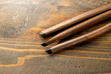Set of calligraphy reeds covered ink on wooden background