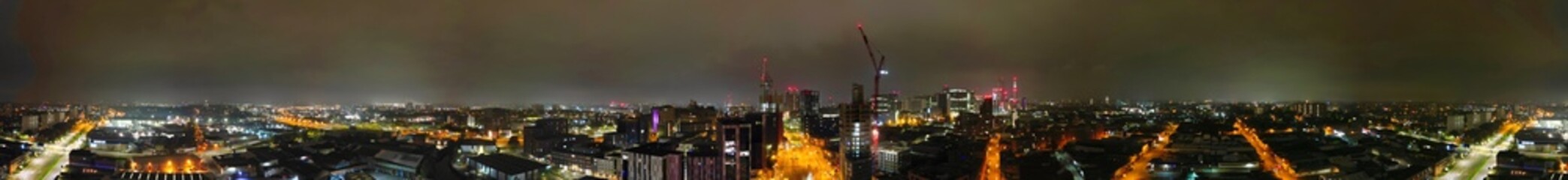 Aerial Panoramic View of Illuminated Downtown Buildings at Central Birmingham City Centre During Night at Midlands, England, United Kingdom. Drone's Camera Footage was Captured on November 4th, 2024.