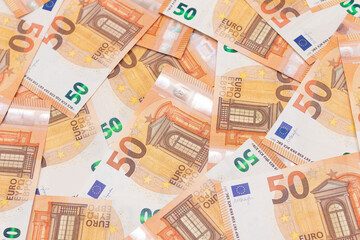 50 Euro Banknotes Money Background. Euro Money Currency. Orange Paper Money. A Lot of Fifty Euro Bills. Business, Finances, Cash and Money Saving Concept