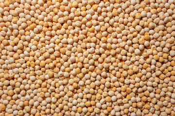 Uncooked Yellow Polished Peas Background. A Culinary Canvas of Dry Yellow Peas, Creating a Lively and Textured Background for Gourmet Cooking. Scattered Raw Polished Peas. Healthy Eating Ingredients