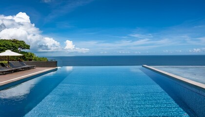 Obraz premium A luxury hotel infinity pool with the ocean at its edge