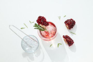 Cocktail with fresh pomegranate on a white background