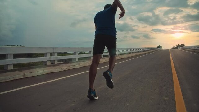 runners is running on the road at outdoors.healthy lifestyle and sport concepts.Sprinting Endurance Workout Training.running for Striding Towards the Future.The Determined Runner.
