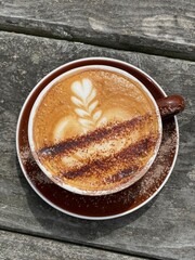 A cup of coffee on the wooden table 