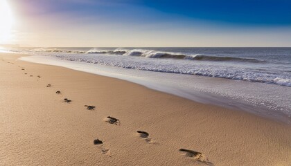 Footprints on the beach sand in the morning