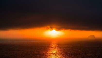 Fototapeta premium A big sun rises under the dark sky