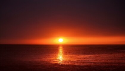 A big sun rises under the dark sky