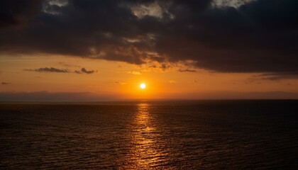 Obraz premium A big sun rises under the dark sky