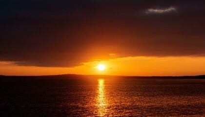 Naklejka premium A big sun rises under the dark sky